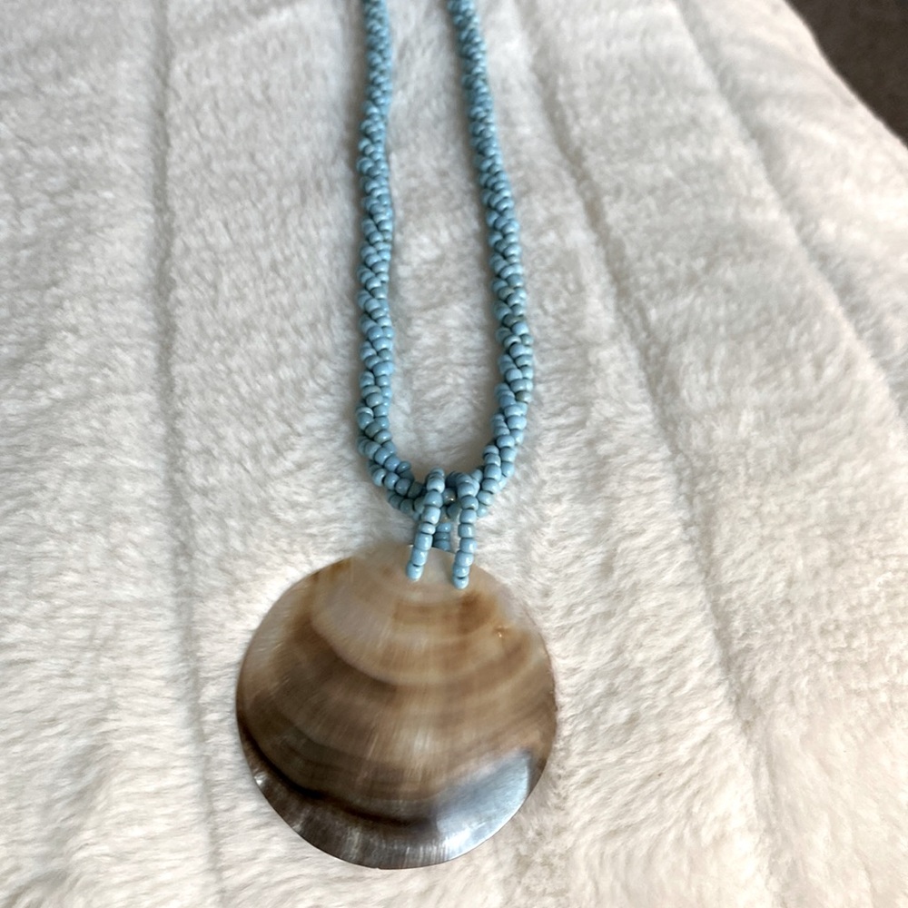 Turquoise bead necklace with mother of Pearl charm